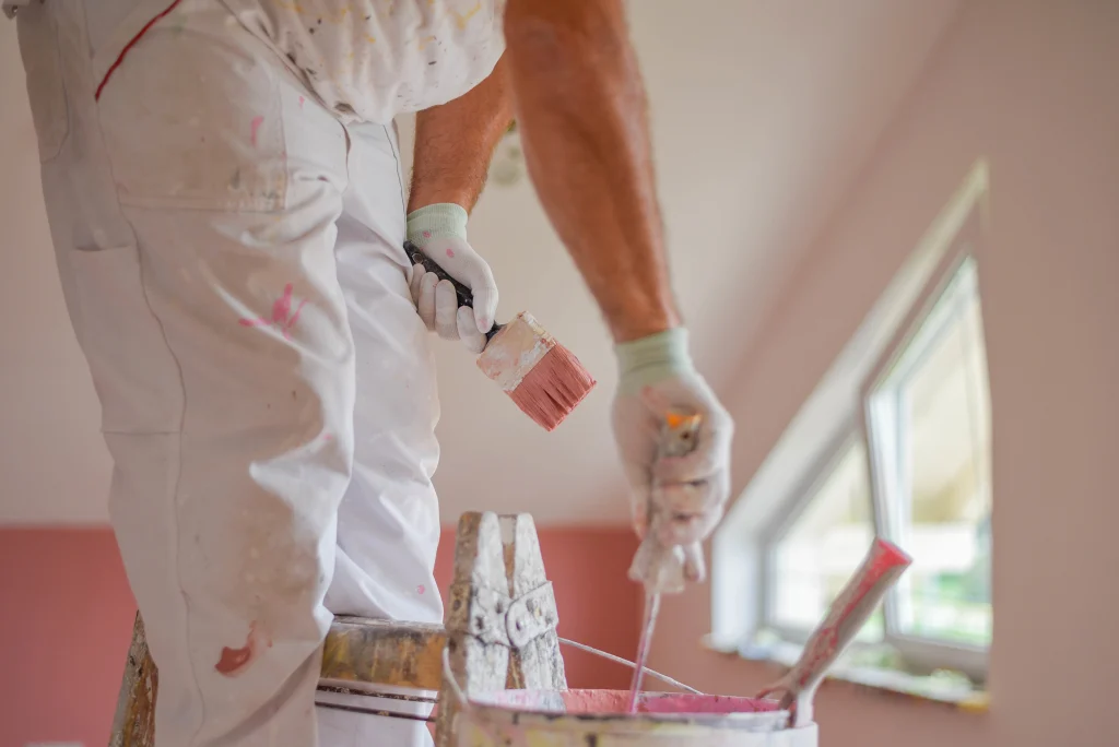 home painter with brush painting interior wall 2026 09 21 17 15 50 utc