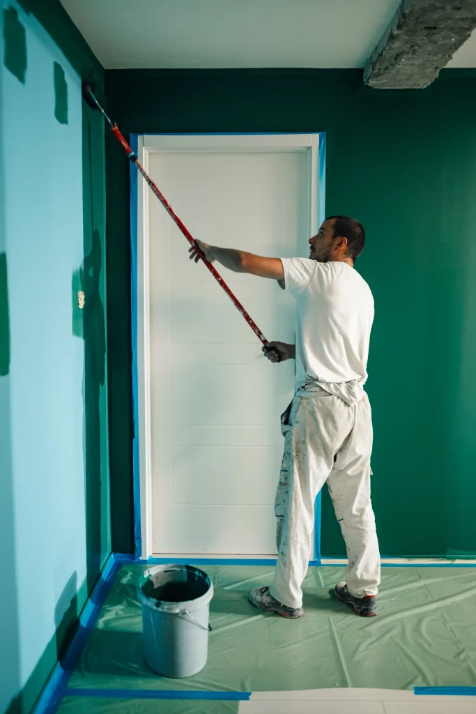 man painting interior room blue and green 2026 09 24 15 48 21 utc