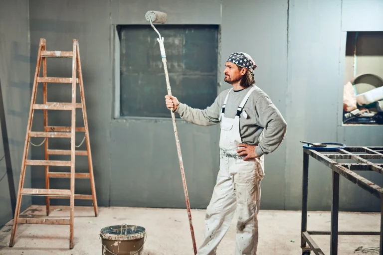 painter posing with roller in indoor workplace set 2026 09 25 02 23 36 utc