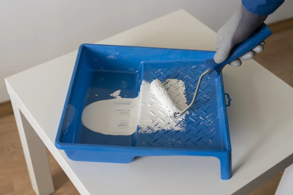 painting supplies on a tabletop with white paint 2026 09 23 03 31 46 utc