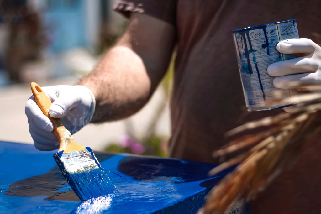 painting table with bright blue paint outdoors 2026 09 21 13 28 18 utc